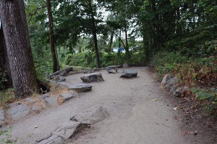 Overlook with boulders for seating – compacted gravel surface – switchback goes to Willamette River